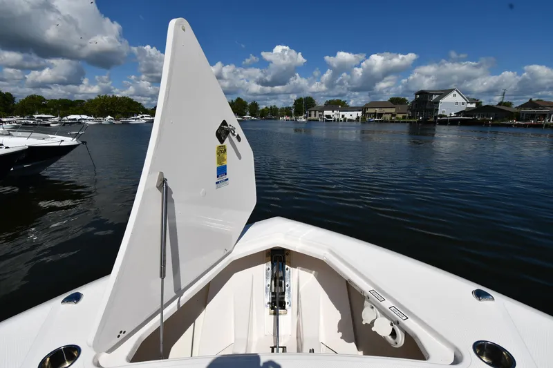 Slide: The Image of 2019 Pursuit S 408 Sport boat with open anchor hatch on a calm lake. - 4