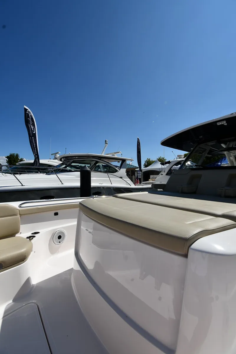 Slide: The Image of 2019 Pursuit S 408 Sport boat interior under clear blue sky. - 48