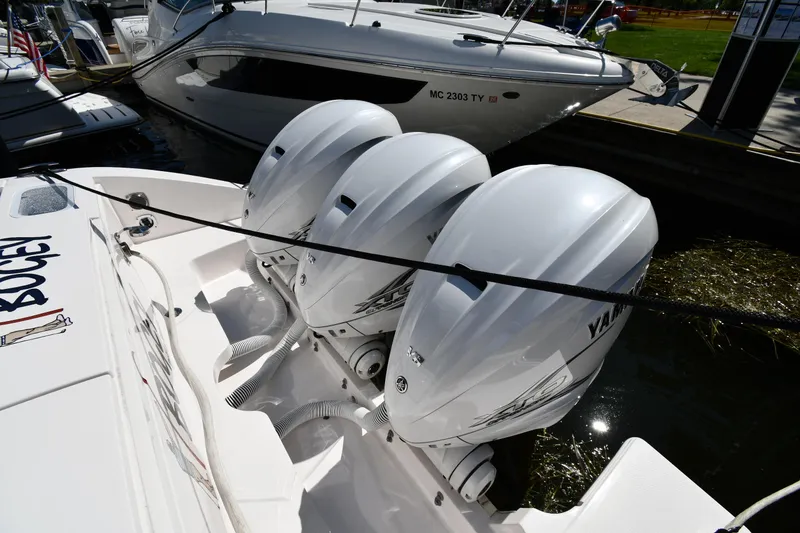 Slide: The Image of 2019 Pursuit S 408 Sport boat with triple Yamaha outboard engines. - 8