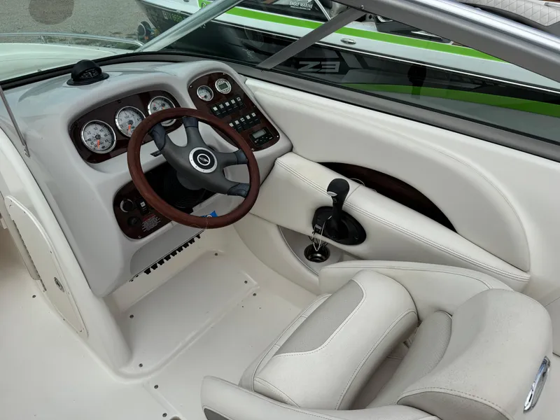 Slide: The Image of 2007 Chaparral 236 SSi boat interior with steering wheel and dashboard controls. - 11