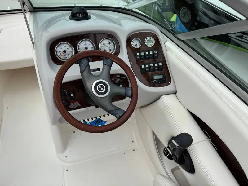 Slide: The Image of 2007 Chaparral 236 SSi boat dashboard with steering wheel and instrument panel. - 12