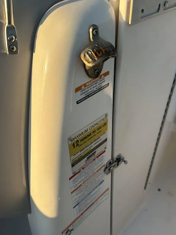 Slide: The Image of 2007 Chaparral 236 SSi boat capacity label and warning sign. - 17