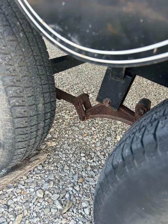 Slide: The Image of Close-up of 2007 Chaparral 236 SSi trailer wheels on gravel. - 18