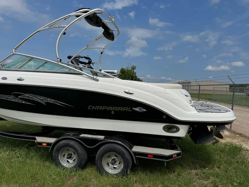 Slide: The Image of 2007 Chaparral 236 SSi boat on trailer, parked on grass under blue sky. - 3
