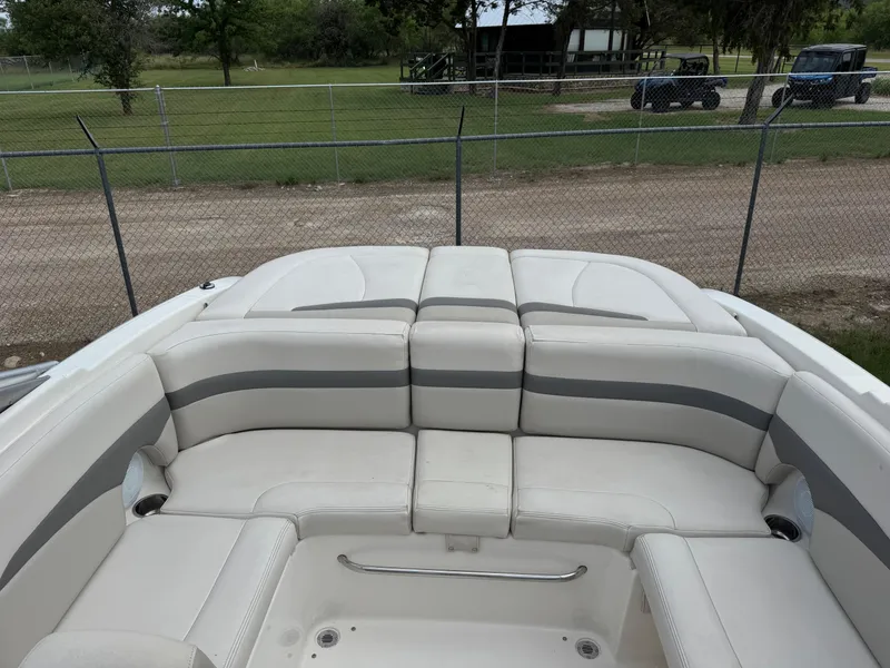 Slide: The Image of 2007 Chaparral 236 SSi boat interior with white and gray seating. - 9