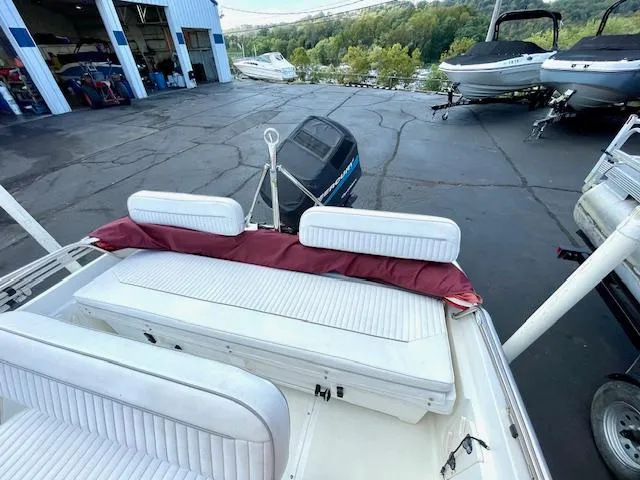 Slide: The Image of 2001 Boston Whaler 18 Dauntless boat at marina with scenic background. - 10