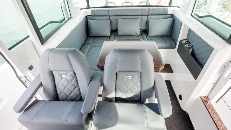Slide: The Image of Luxurious interior of 2025 Axopar 37 XC CROSS CABIN with plush seating and modern design. - 25