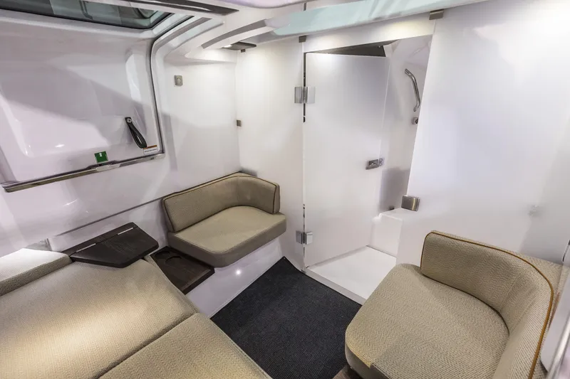 Slide: The Image of Interior of 2025 Axopar 37 XC CROSS CABIN, featuring modern seating and sleek design. - 32