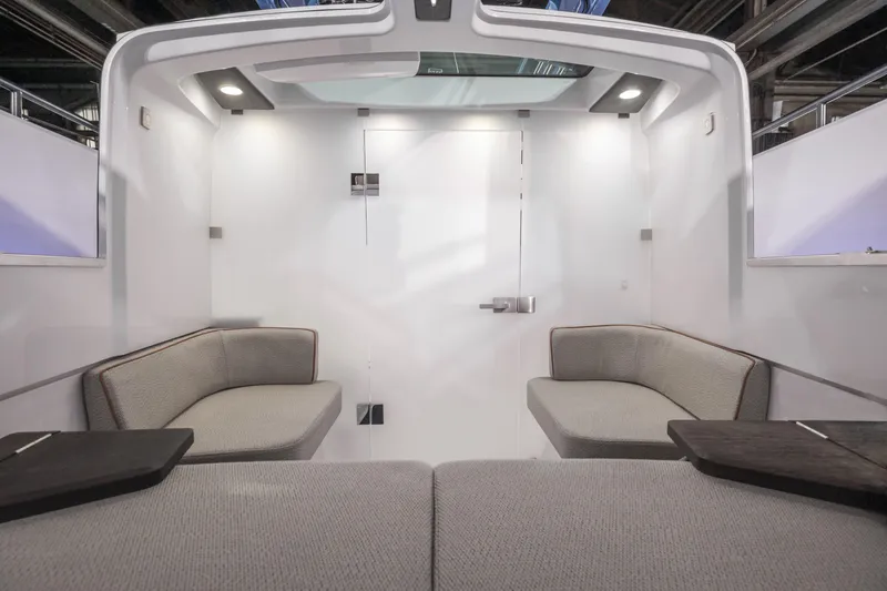 Slide: The Image of Interior of 2025 Axopar 37 XC CROSS CABIN, featuring modern seating and sleek design. - 34