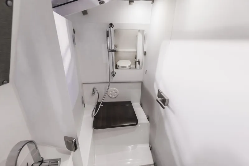 Slide: The Image of 2025 Axopar 37 XC CROSS CABIN bathroom with modern fixtures and sleek design. - 36