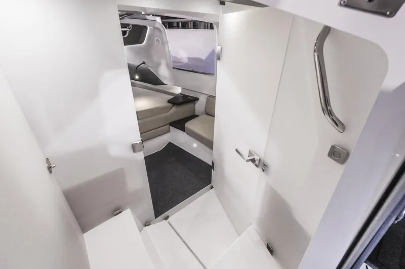 Slide: The Image of 2025 Axopar 37 XC CROSS CABIN interior with modern seating and sleek design. - 38