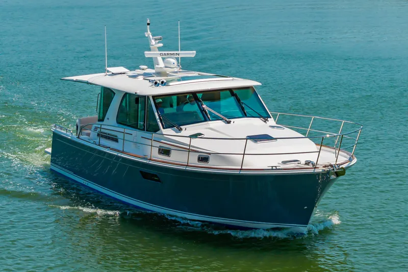 Slide: The Image of 2026 Sabre 43 Salon Express yacht cruising on calm waters. - 5