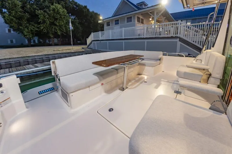 Slide: The Image of 2026 Sabre 43 Salon Express yacht with spacious outdoor seating and elegant design. - 12