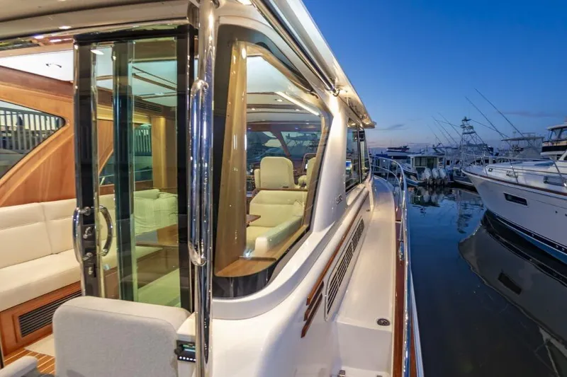 Slide: The Image of 2026 Sabre 43 Salon Express yacht docked at sunset. - 35