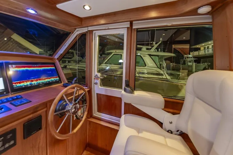 Slide: The Image of Interior of 2026 Sabre 43 Salon Express with helm station. - 34