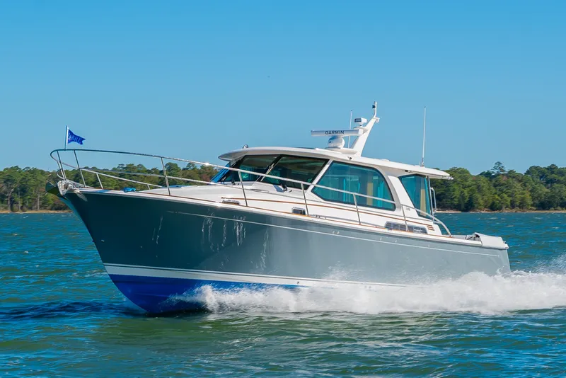 The Image of 2026 Sabre 43 Salon Express cruising on a sunny day, showcasing sleek design and performance. - 0