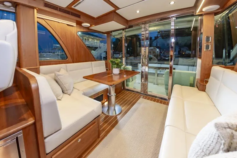 Slide: The Image of Interior of 2026 Sabre 43 Salon Express with luxurious wood furnishings. - 39