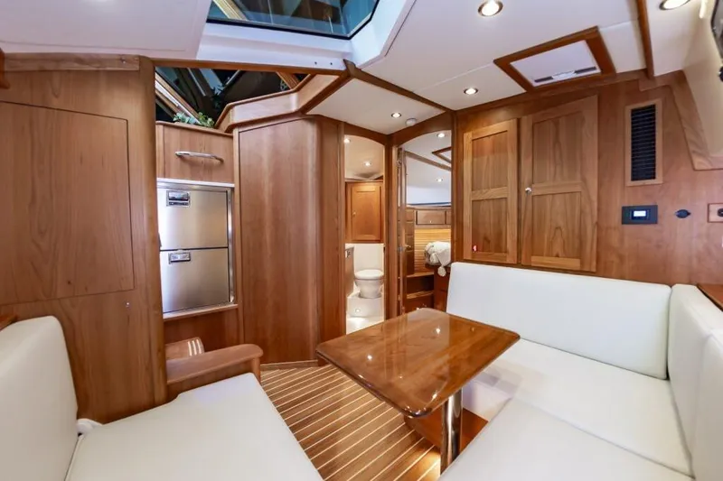 Slide: The Image of Luxurious interior of 2026 Sabre 43 Salon Express yacht with wood finishes and seating area. - 20
