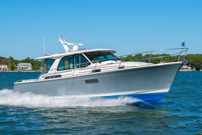 Slide: The Image of 2026 Sabre 43 Salon Express cruising on a sunny day, showcasing sleek design and performance. - 1