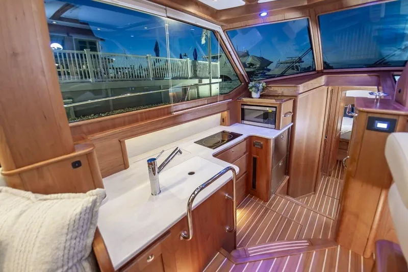 Slide: The Image of Interior of 2026 Sabre 43 Salon Express with modern kitchen. - 28