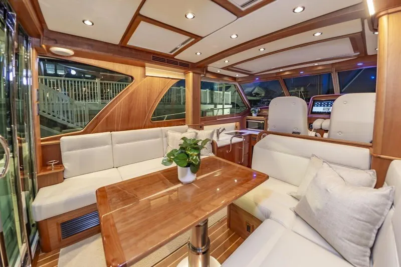 Slide: The Image of Luxurious interior of 2026 Sabre 43 Salon Express yacht with elegant seating and wooden finishes. - 14