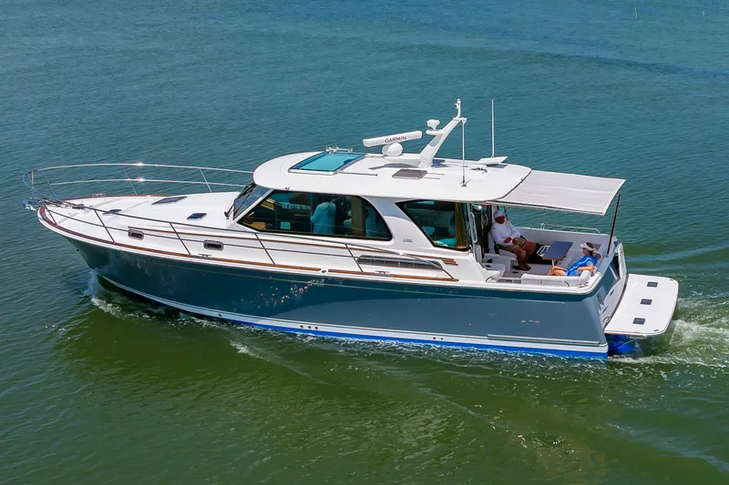 Slide: The Image of 2026 Sabre 43 Salon Express yacht cruising on calm waters. - 9