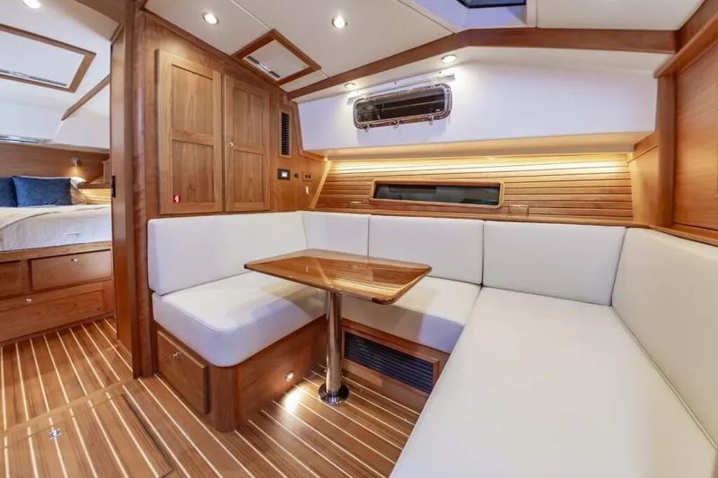 Slide: The Image of Luxurious interior of 2026 Sabre 43 Salon Express yacht with wood finish and cozy seating. - 22