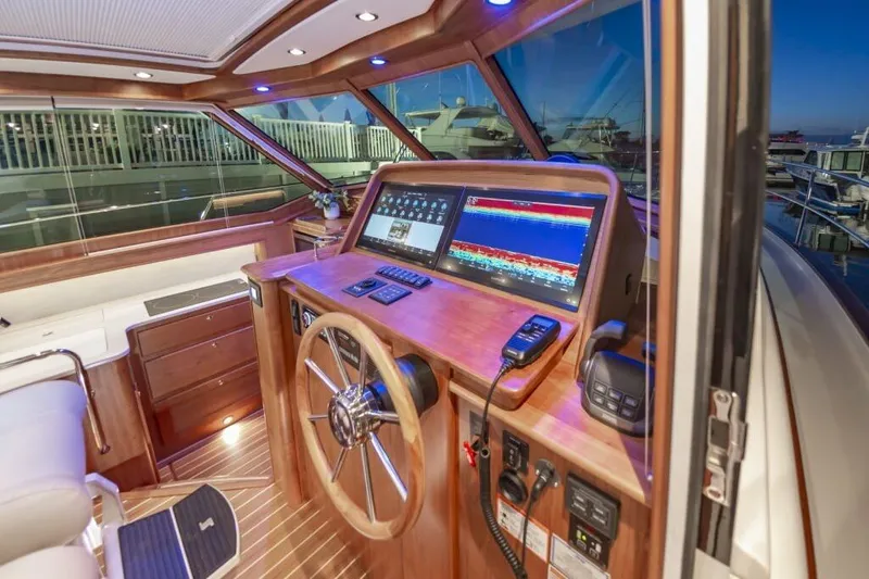 Slide: The Image of Interior of 2026 Sabre 43 Salon Express with modern helm console. - 33