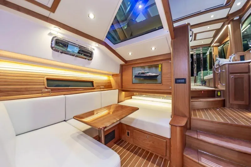 Slide: The Image of Luxurious interior of 2026 Sabre 43 Salon Express yacht with wood finishes and plush seating. - 21