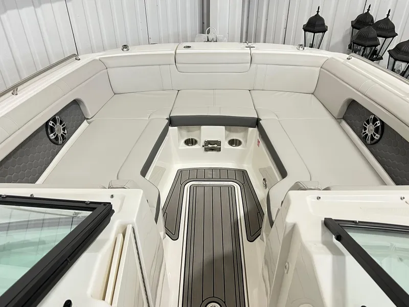 Slide: The Image of 2025 Sea Ray SDX 290 boat interior with spacious seating and modern design. - 12