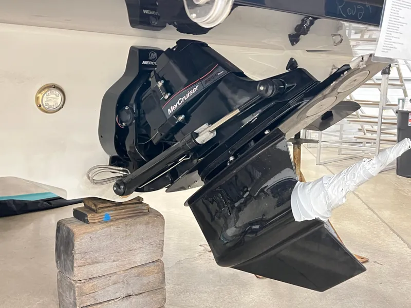 Slide: The Image of 2025 Sea Ray SDX 290 boat with MerCruiser engine, displayed on wooden blocks. - 5