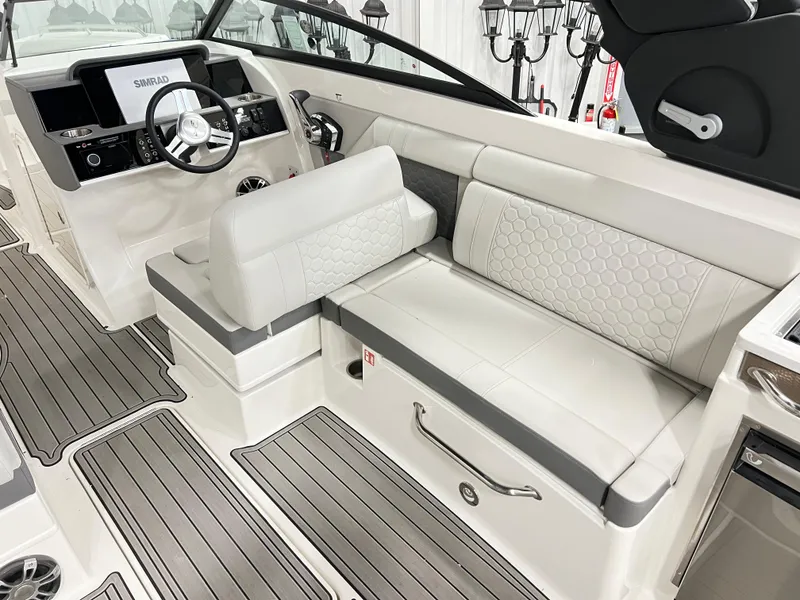 Slide: The Image of 2025 Sea Ray SDX 290 boat interior with modern helm and luxurious seating. - 8