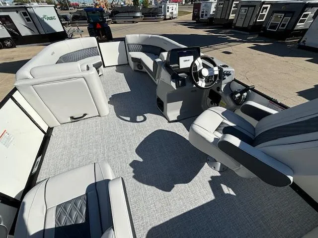 Slide: The Image of 2024 Harris Sunliner 230 CWDH pontoon boat interior with modern seating and steering console. - 10
