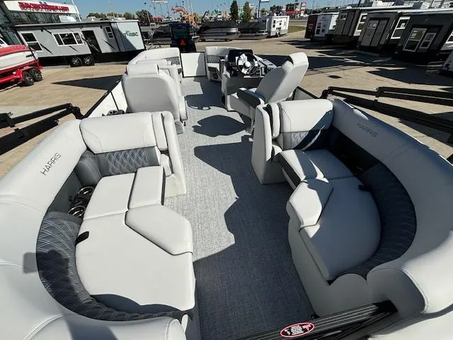 Slide: The Image of 2024 Harris Sunliner 230 CWDH pontoon boat interior with luxurious seating and modern design. - 12