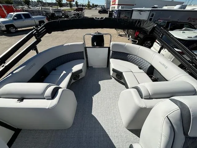 Slide: The Image of 2024 Harris Sunliner 230 CWDH pontoon boat with spacious seating and modern design. - 14