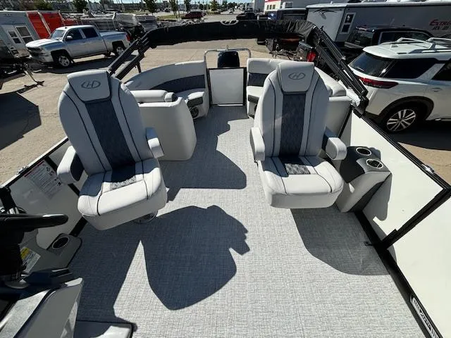 Slide: The Image of 2024 Harris Sunliner 230 CWDH interior with plush seating and modern design. - 16