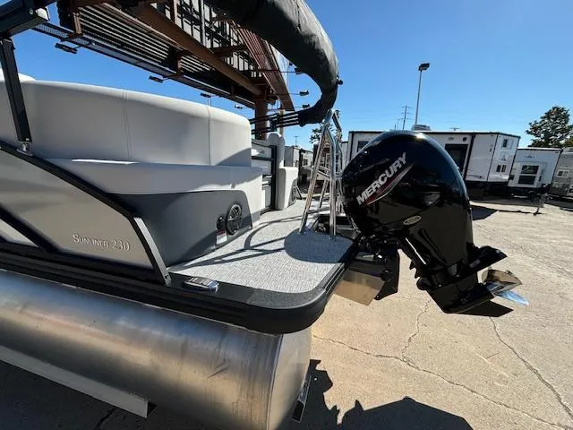 Slide: The Image of 2024 Harris Sunliner 230 CWDH pontoon boat with Mercury outboard motor. - 21