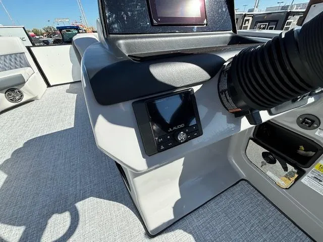 Slide: The Image of 2024 Harris Sunliner 230 CWDH boat dashboard with audio controls and modern design. - 4