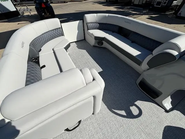 Slide: The Image of 2024 Harris Sunliner 230 CWDH boat interior with plush seating and modern design. - 9