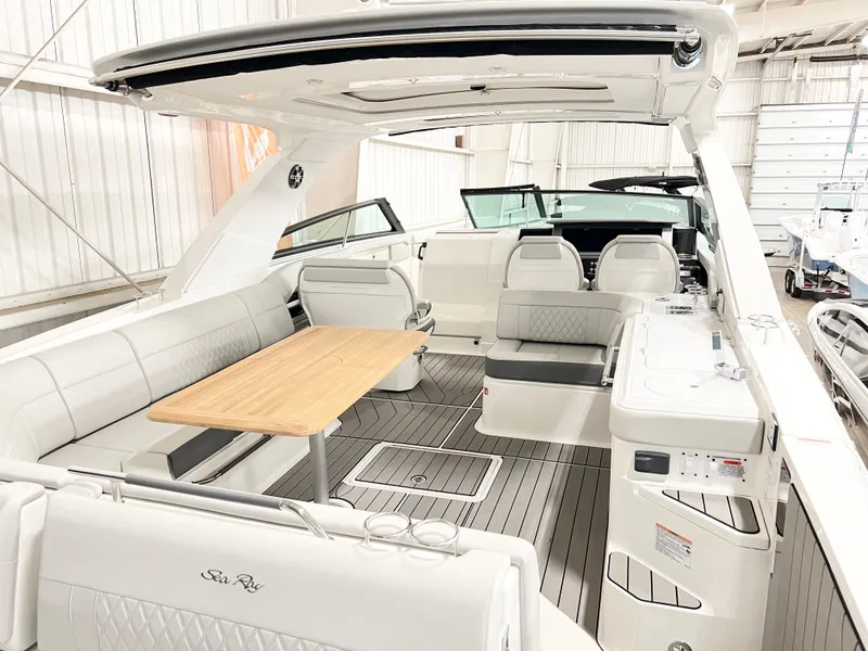 Slide: The Image of 2025 Sea Ray SLX 400 luxury boat interior with spacious seating and elegant design. - 6