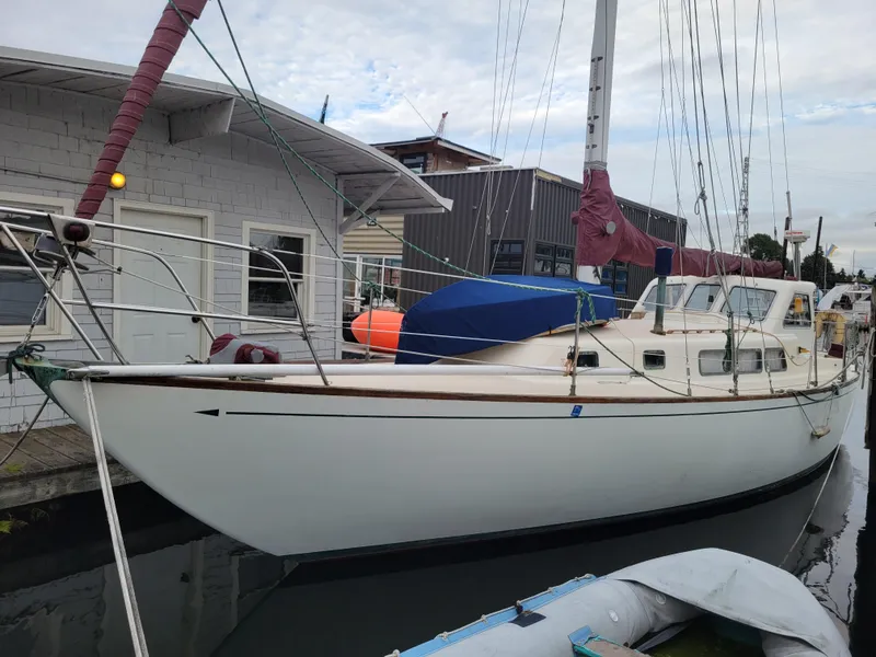 The Image of 1967 Spencer 42 sailboat docked at marina, featuring classic design and white hull. - 0