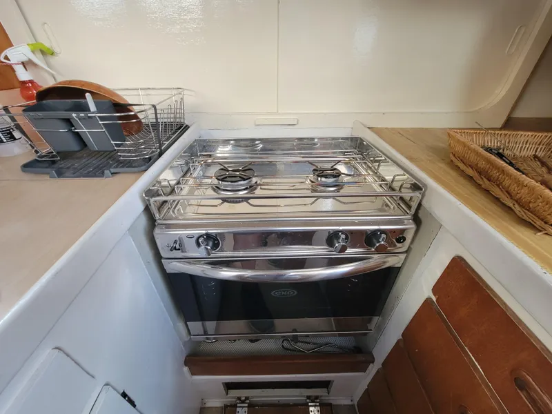Slide: The Image of Compact kitchen stove in a 1967 Spencer 42 boat galley. - 17