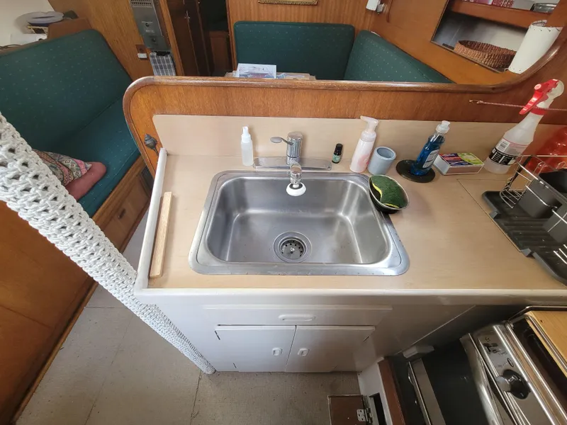Slide: The Image of 1967 Spencer 42 yacht kitchen with sink and countertop essentials. - 18