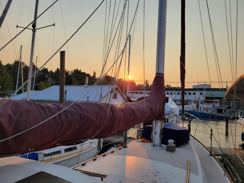 Slide: The Image of Sailboat deck at sunset, Spencer 42 model, 1967, docked in a marina. - 39