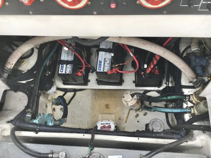 Slide: The Image of Engine compartment of 2006 Seaswirl Striper 2901 with batteries and wiring. - 12