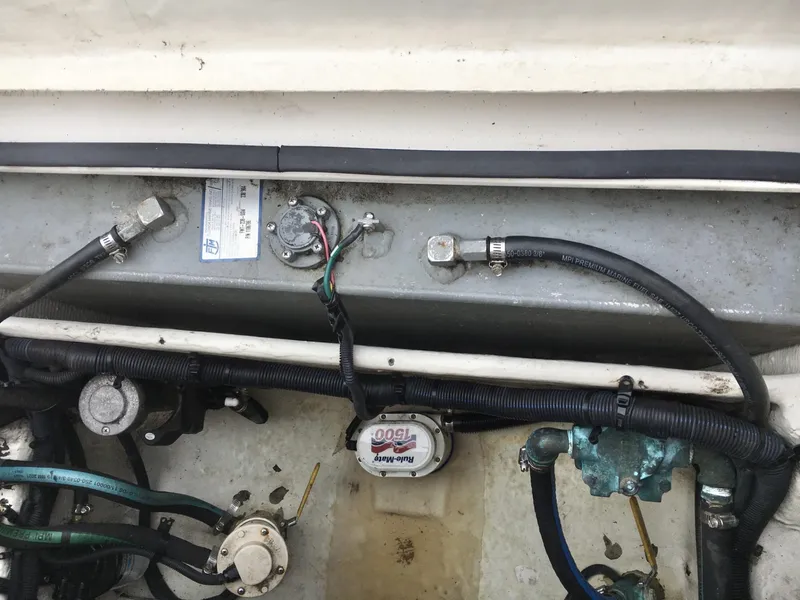 Slide: The Image of 2006 Seaswirl Striper 2901 Walkaround O/B engine compartment with wiring and components. - 13