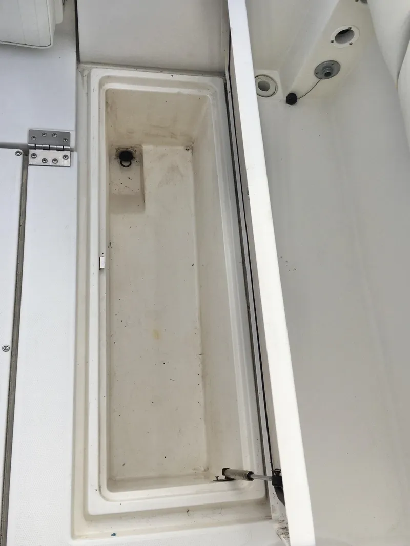 Slide: The Image of 2006 Seaswirl Striper 2901 Walkaround O/B boat storage compartment, open and empty. - 15