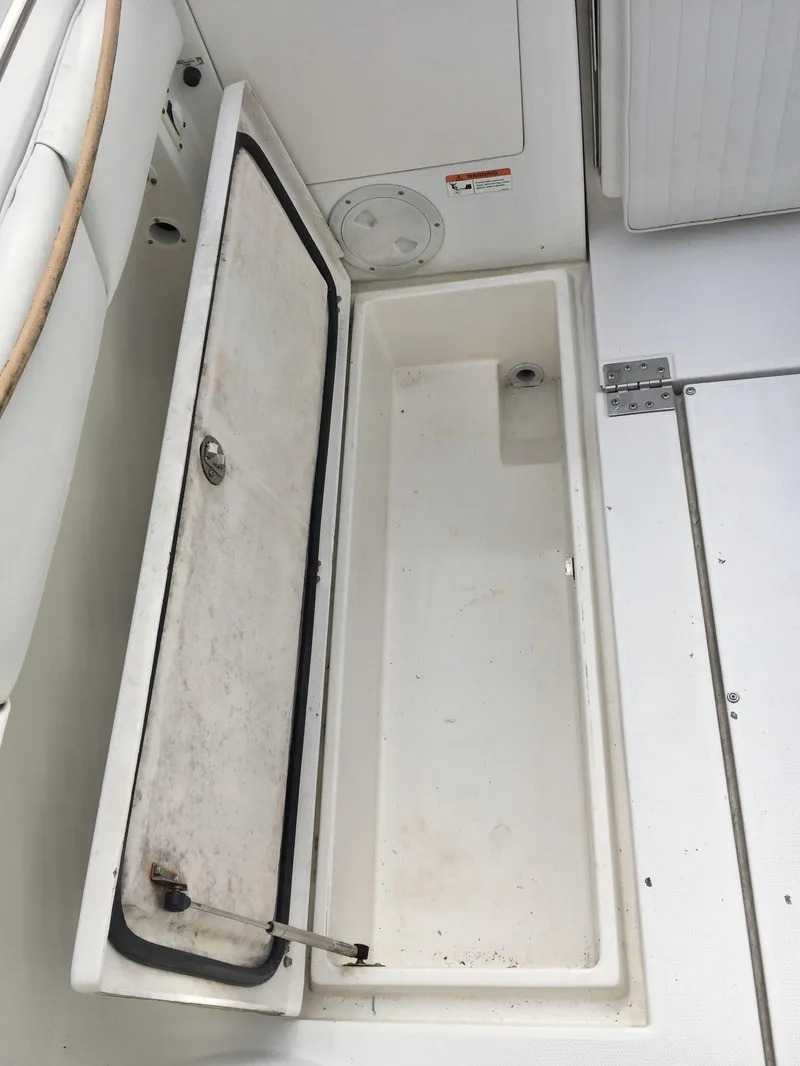Slide: The Image of Open storage compartment on 2006 Seaswirl Striper 2901 Walkaround O/B boat deck. - 16