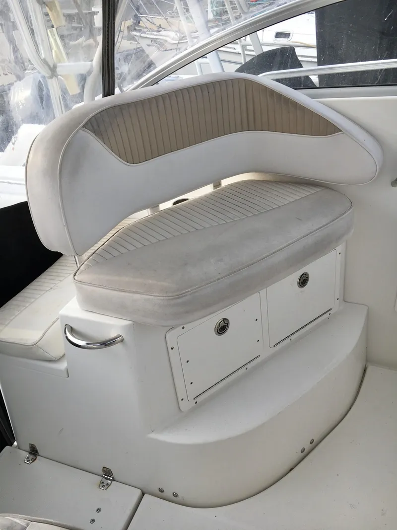 Slide: The Image of 2006 Seaswirl Striper 2901 Walkaround O/B boat seating area with storage compartments. - 24