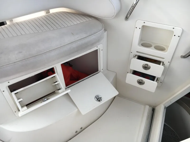 Slide: The Image of 2006 Seaswirl Striper 2901 Walkaround O/B interior storage compartments and seating area. - 25